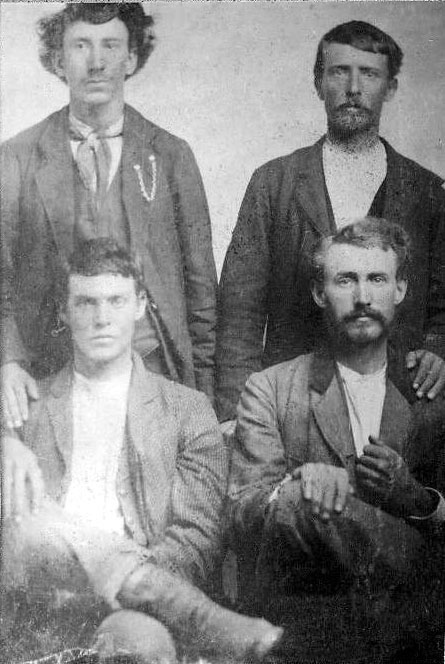 front, James H. Norris and brother-in-law Felix M. May; back, James’s brother-in-law Andrew J. May and W. Tom Norris